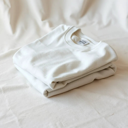 Folded 100% combed cotton t-shirt showing smooth knit texture and soft drape